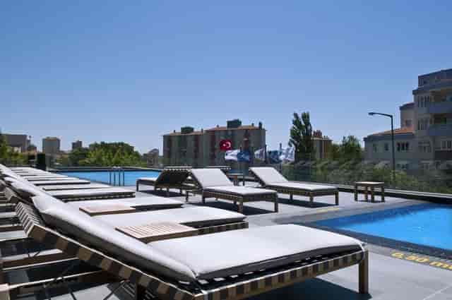 Modern outdoor pool deck event space, Radisson Blu Istanbul Asia, ideal for cocktail receptions.
