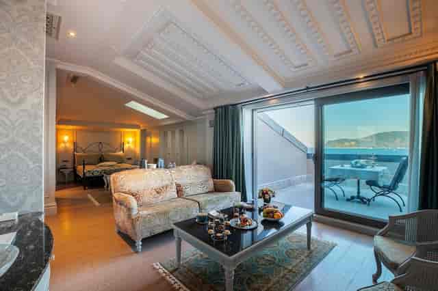 Luxury suite with private coastal terrace at MFB Tarabya Hotel for executive retreats.