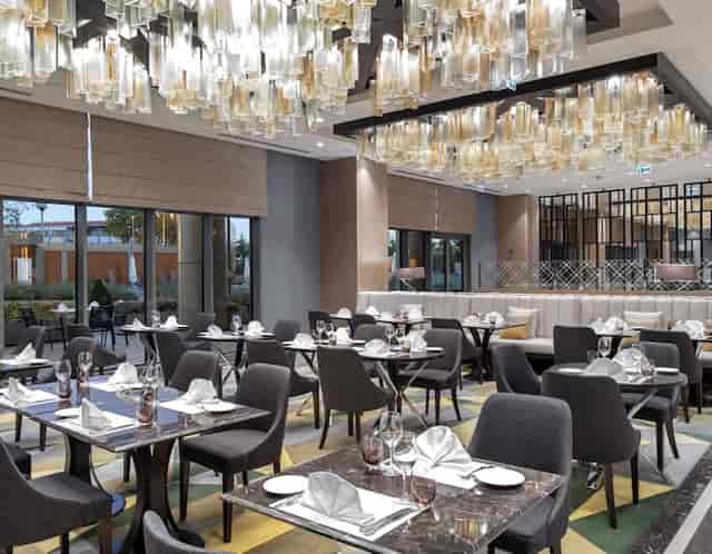 Upscale Hilton Istanbul Bakirkoy banquet hall with statement lighting for corporate events.