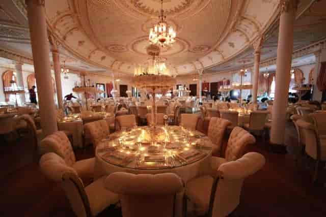 Elegant tufted seating at Adile Sultan Palace ballroom for a gala dinner or formal reception.