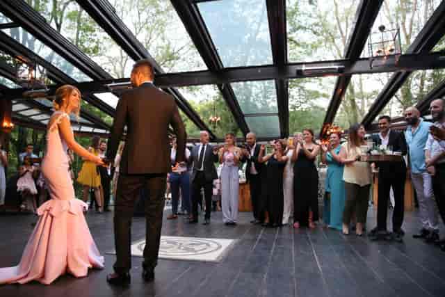 Henna Bachelorette party in a glass atrium; elegant milestone event venue with natural lighting.