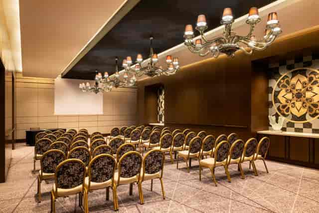 Raffles Istanbul boardroom with elegant chandeliers for corporate seminars and presentations.