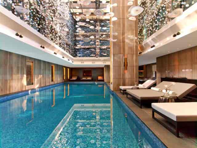 Luxury indoor pool at Raffles Istanbul for executive retreats and wellness incentive travel.