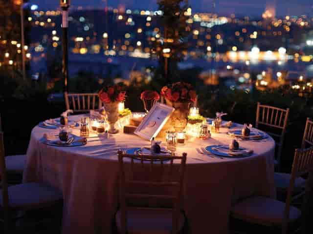 Elegant gala dinner tablescape at Terrace in 29 with dramatic bokeh lighting for luxury events.