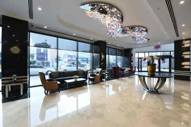 Luxury hotel lobby, contemporary design, perfect for VIP arrivals and corporate event registration.