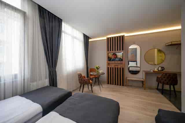 Modern twin hotel room at Seyithan Palace, ideal for business meetings and corporate event blocks.