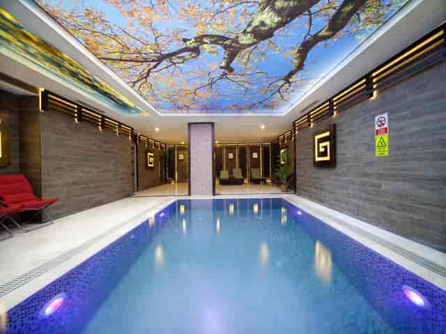 Luxury suite at Grand Hotel de Pera, boutique wellness space for executive retreats and travel.