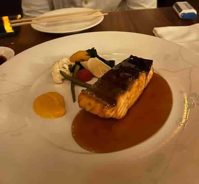Glazed salmon filet with roasted vegetables at Nobu Istanbul banquet catering event.