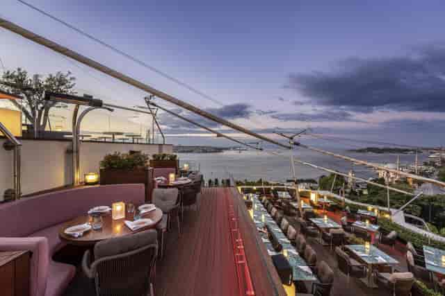 Luxury rooftop restaurant for evening networking receptions and sunset cocktail events.
