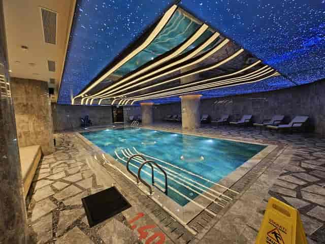 Luxury indoor pool at CANUS Mövenpick Istanbul for upscale corporate events and incentive travel.