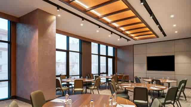 Mövenpick Istanbul Marmara Sea breakout room with round tables for corporate meetings and events.