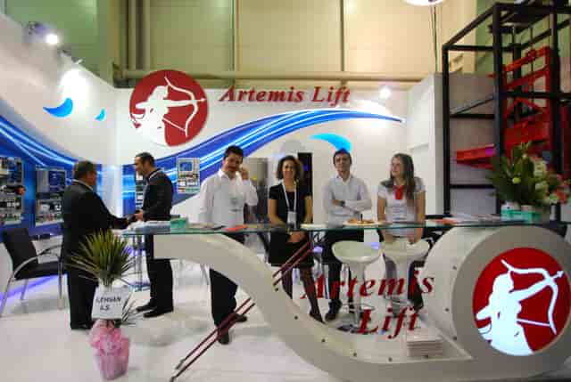 Artemis branded trade show booth with modern curved counter at Istanbul World Trade Center event.