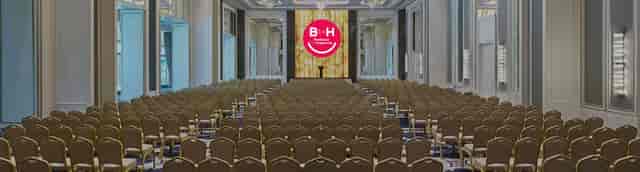 Theater-style plenary session at WTC Istanbul conference center with branded LED backdrop.