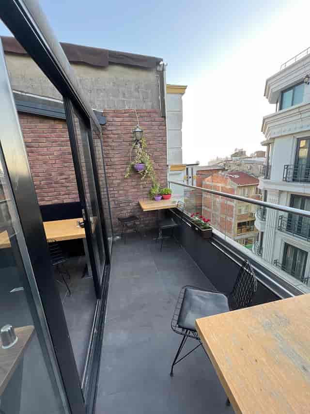 Modern Istanbul hotel terrace with industrial brick for private networking and corporate events.