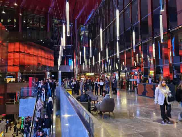 Turkcell Stage multi-level venue lobby for corporate event registration and networking.
