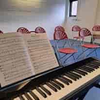Folding chairs in Brentwood Theatre auditorium for community rehearsal and performance event space.