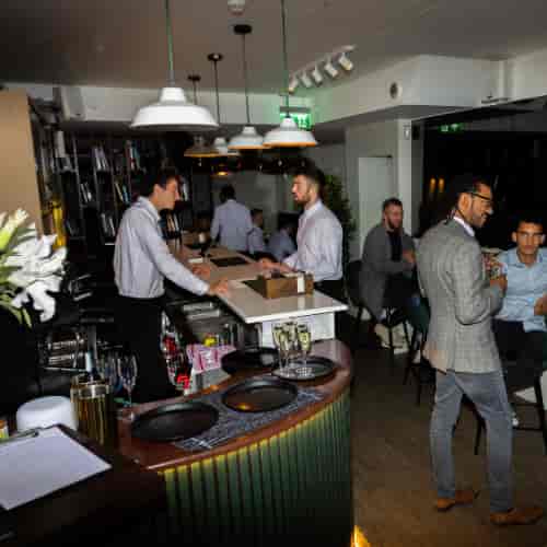 Corporate networking reception with mood lighting at Simul Place event venue.