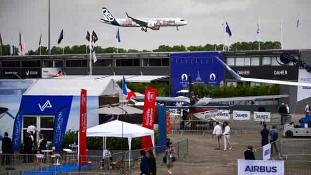 Outdoor display structures at Paris Air Show, featuring experiential brand activation trade booths.