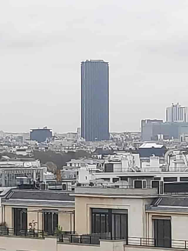 Rooftop venue with Eiffel Tower view, perfect for corporate events and luxury gala dinner rental.