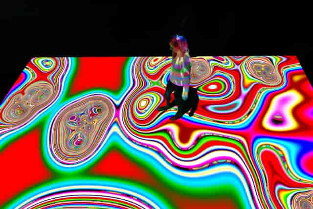 Interactive floor projection at Grand Palais Immersif for experiential event engagement.