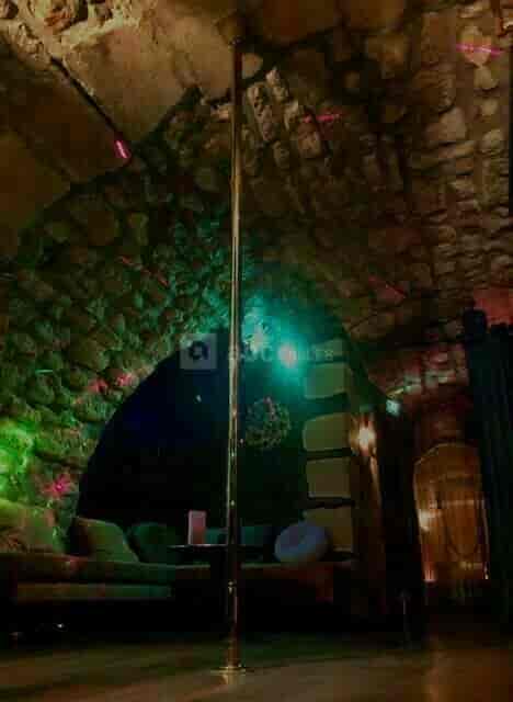 Maison Faust function room with stone masonry for atmospheric private events and evening parties.