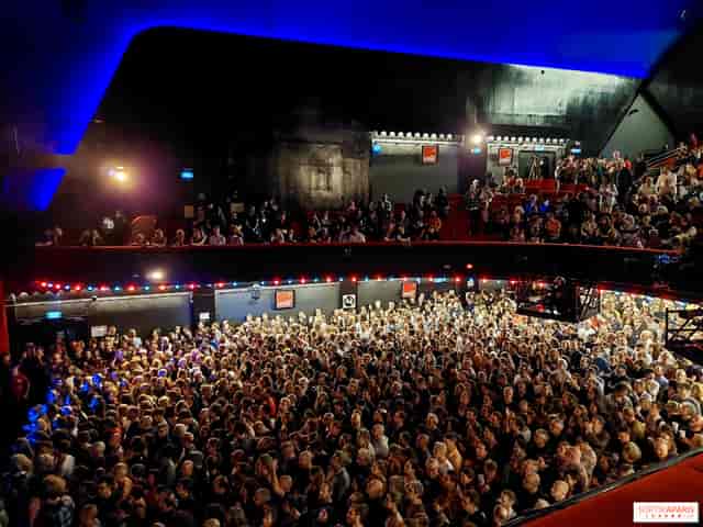 Sold-out L'Olympia performance hall with tiered seating for event venue rental and concert planning.
