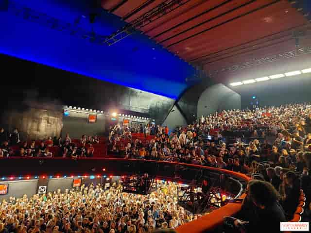 L'Olympia theater stage with multi-level seating for keynote sessions and ticketed events.