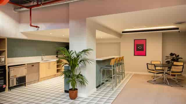 Meeting Room F: Break-out space with kitchenette for corporate networking and team meetings.