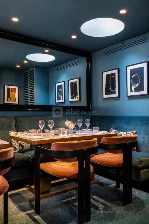 Plush velvet banquette in Salon Gallimard, perfect for VIP client dinners and business lunches.