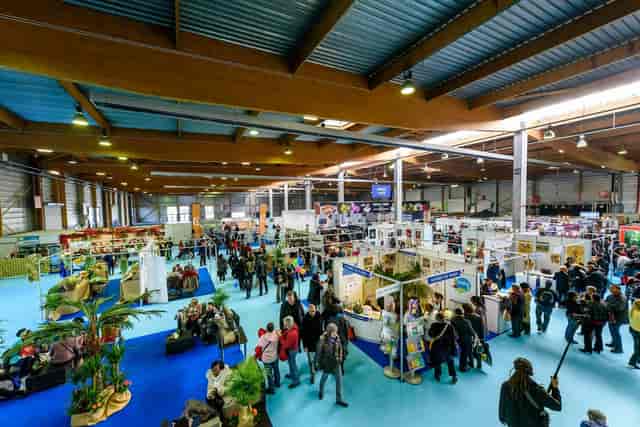 Paris Event Center Hall A: exhibition floor with booths and attendees for trade shows and conferences.