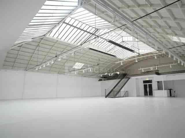 Industrial-chic Espace Commines venue with skylights for brand activations and product launches.