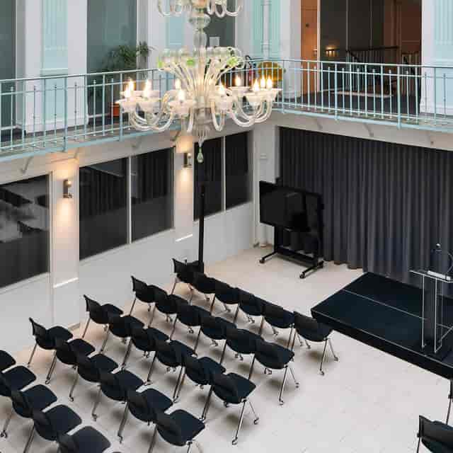 Corporate event space at Formeret featuring theater seating and historic architecture.