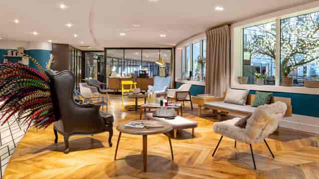 Modern VIP breakout room with lounge seating for corporate networking and business events.