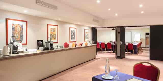 Etoile Saint-Honoré conference room with refreshment station for business meetings and events.