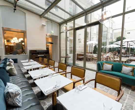The Orangerie at The Hoxton, Paris: bright atrium event space for corporate luncheons and receptions.
