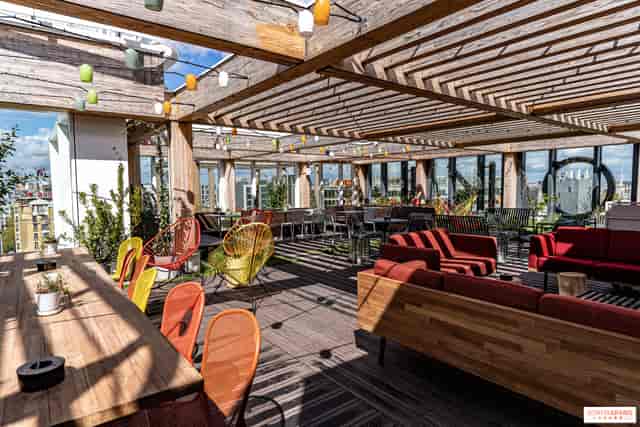 Zoku Paris Living Kitchen rooftop venue with pergola for networking mixers and breakout sessions.