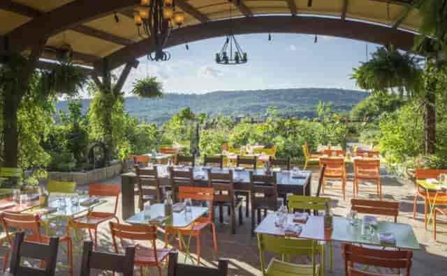 Open-air hotel venue with modular layout, perfect for social mixers and al fresco dining events.