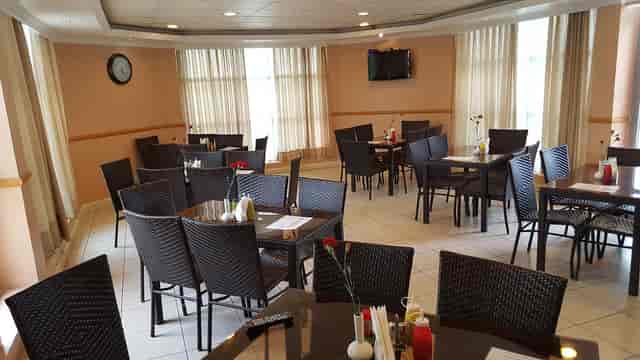 Mayfair Hotel conference room with wicker seating for corporate breakout sessions and events.