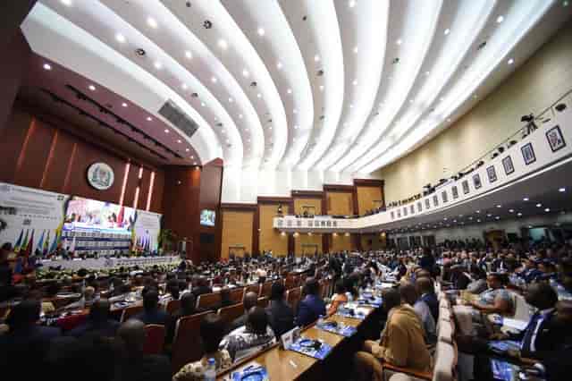 AICC Main Auditorium plenary hall with tiered seating for international conference events.