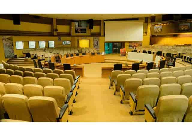 AICC auditorium with tiered seating for formal business conferences and professional events.