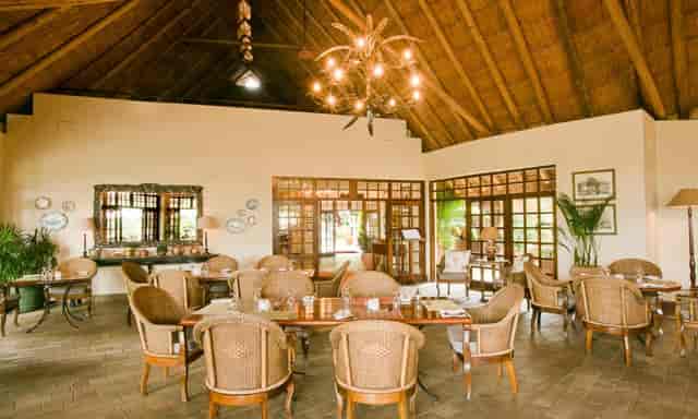 Rustic-chic Ilala Lodge restaurant with thatched roof for corporate retreats and board meetings.