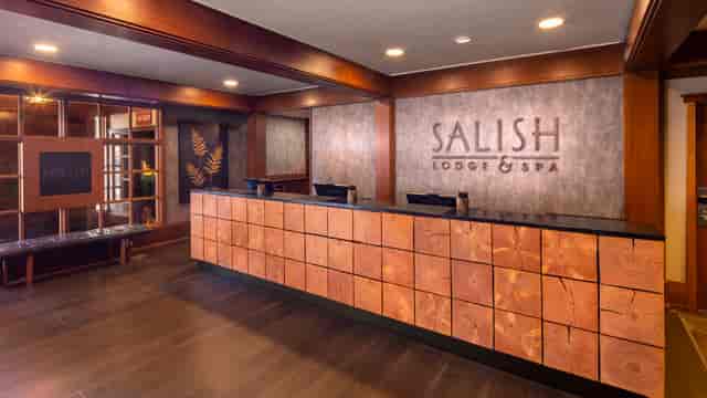 Rustic-chic wood desk at Salish Lodge & Spa wine cellar for corporate events and conference check-in.