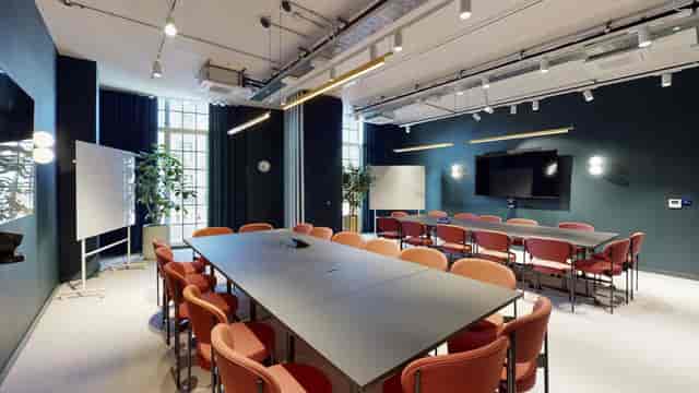 Modern boardroom with modular table for professional workshops and corporate meetings.