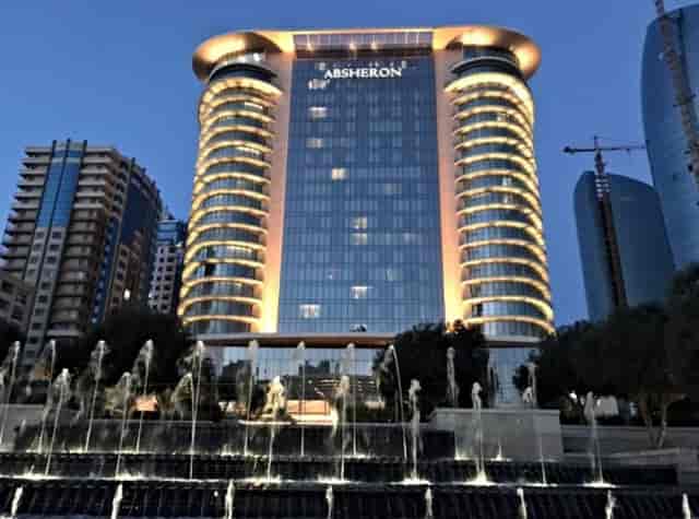 JW Marriott Absheron Baku hotel exterior with fountain for corporate events and luxury summits.
