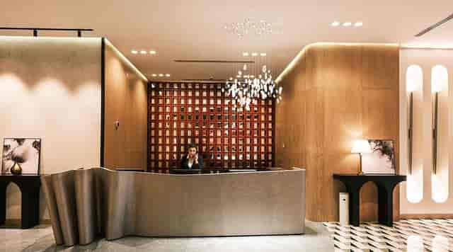 Modern luxury hotel lobby lounge with warm lighting for premium VIP events and brand activations.