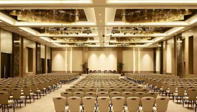Theater-style ballroom with AV trussing for corporate conferences and keynote events at Iron Hotel.