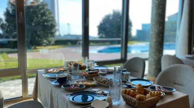 Executive breakfast meeting in scenic Badam d'Art Boutique Hotel banquet hall.