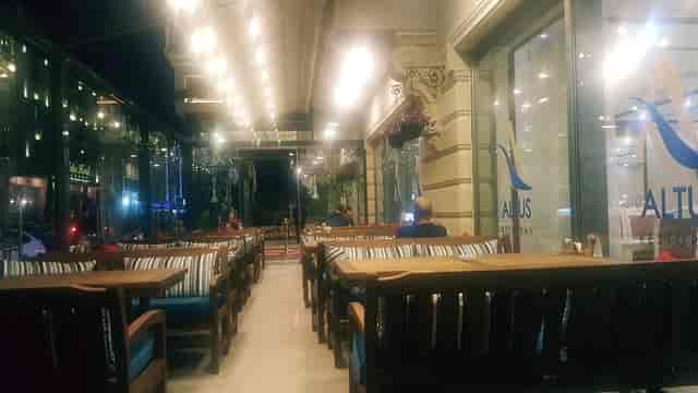 Royal Crown Restaurant terrace with bench seating, ideal for evening receptions and networking.