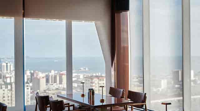 Luxury executive dining room with city view for board meetings and VIP networking.