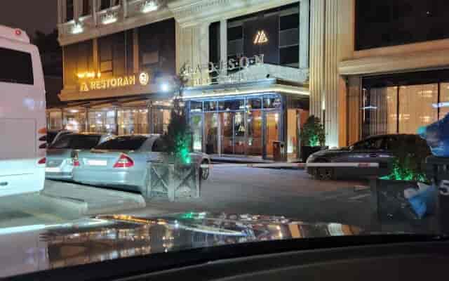 Addison Hotel restaurant exterior with motorcoach, ideal for group events and corporate travel.